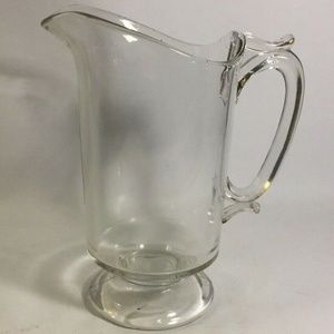 9" clear hand blown glass pitcher, includes air bubbles
